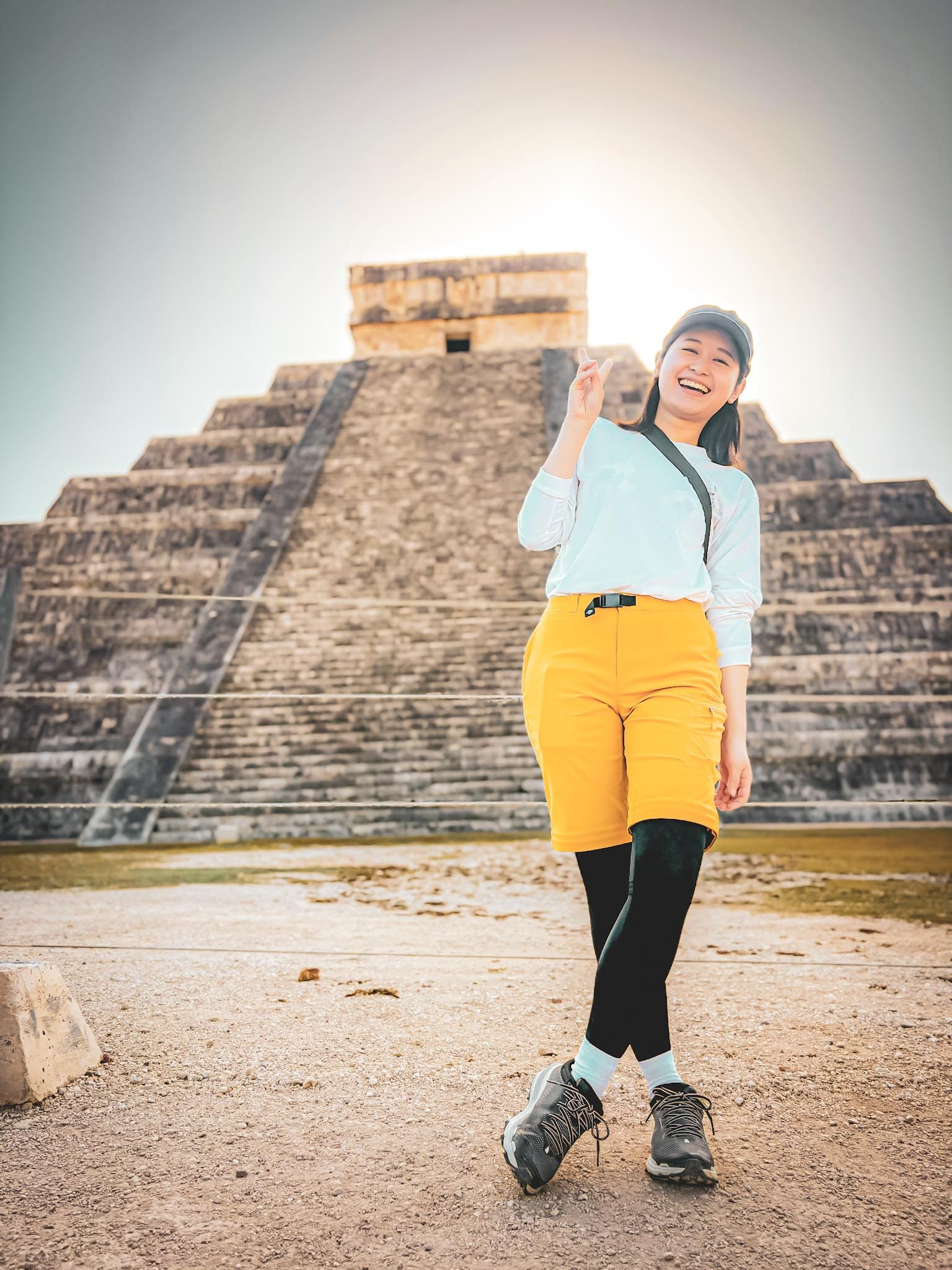 Traveler smiling in front of El Castillo at Chichen Itza