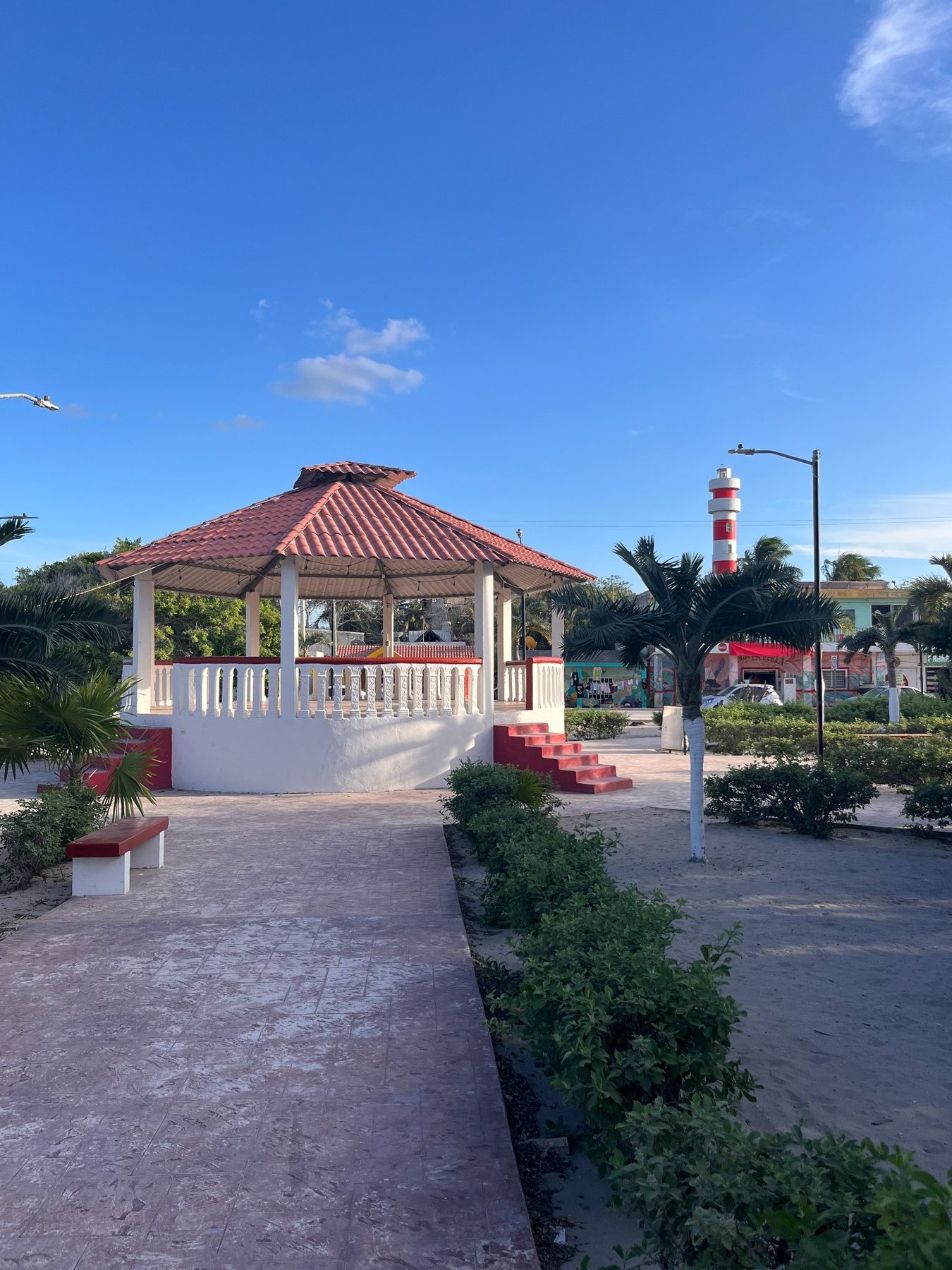 Main square and lighthouse in El Cuyo Yucatán under a clear blue sky