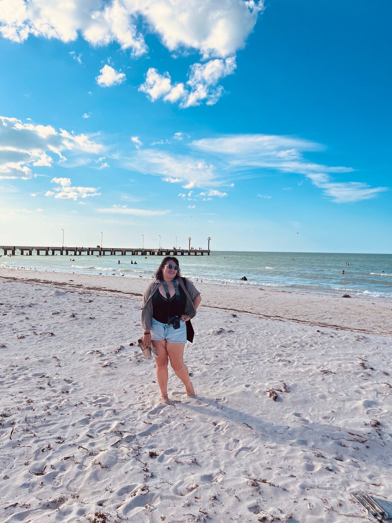 White sand beach in El Cuyo with blue sky and peaceful shoreline